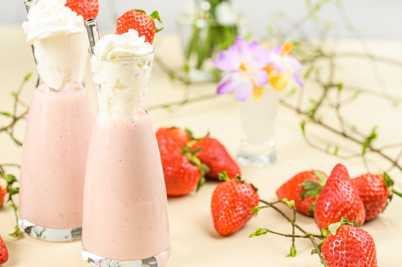 Thick creamy vanilla milkshake with whipped cream